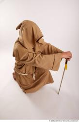 JOEL_ADAMSON MONK KNEELING POSE WITH SWORD